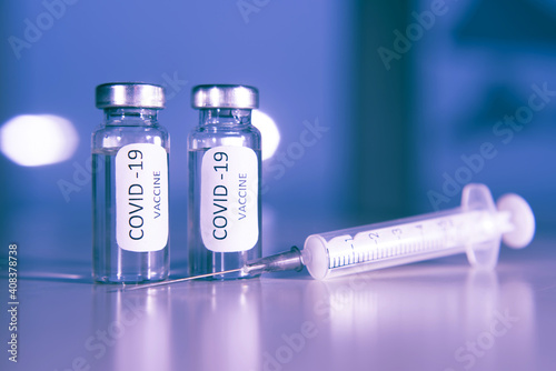 Vaccination against coronavirus COVID-19. Ampoule and syringe close-up. Concept