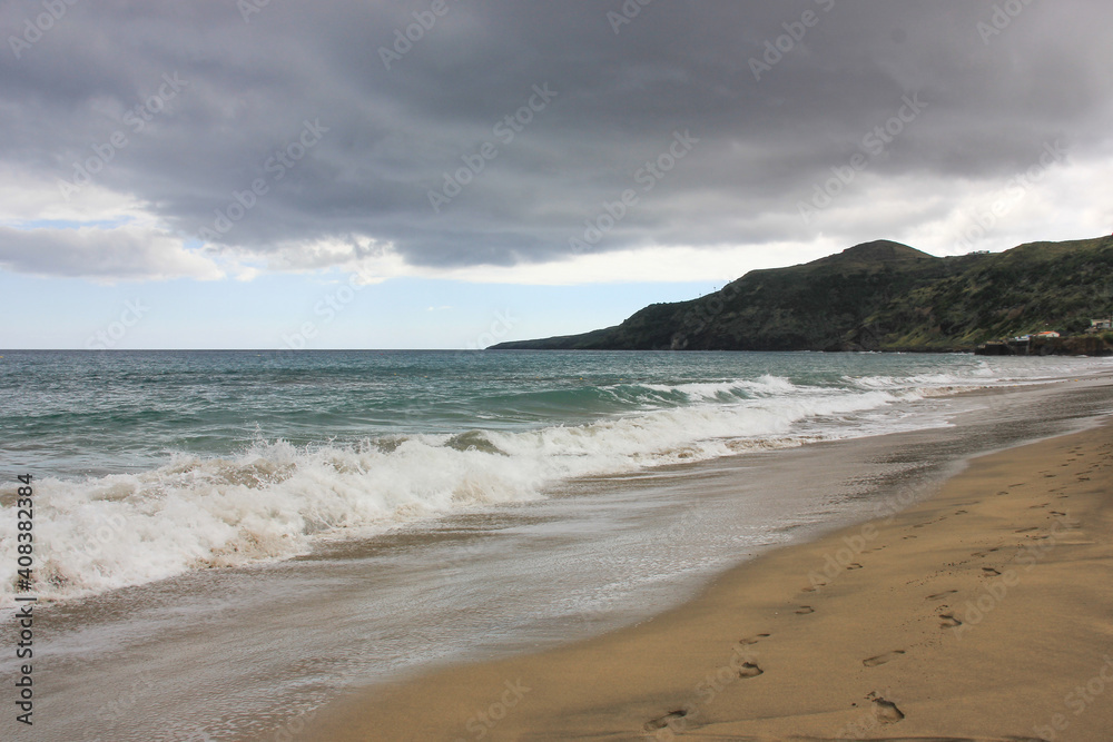 Breaking wave, light sand, Azores, Santa Maria island. Breaking wave, light sand, Azores, Santa Maria island.