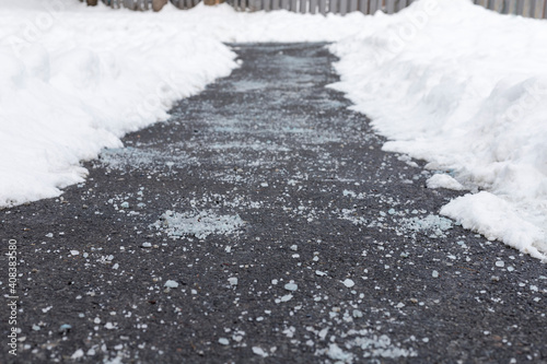 Winter road with salt for melting snow