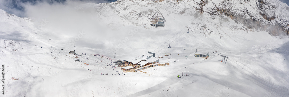 Panoramic aerial view of Sonnalpin restaurant in heavy snow below Zugspitze Top of Germany Panoramic aerial view of Sonnalpin restaurant in heavy snow below Zugspitze Top of Germany