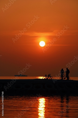 silhouette of friends on the beach