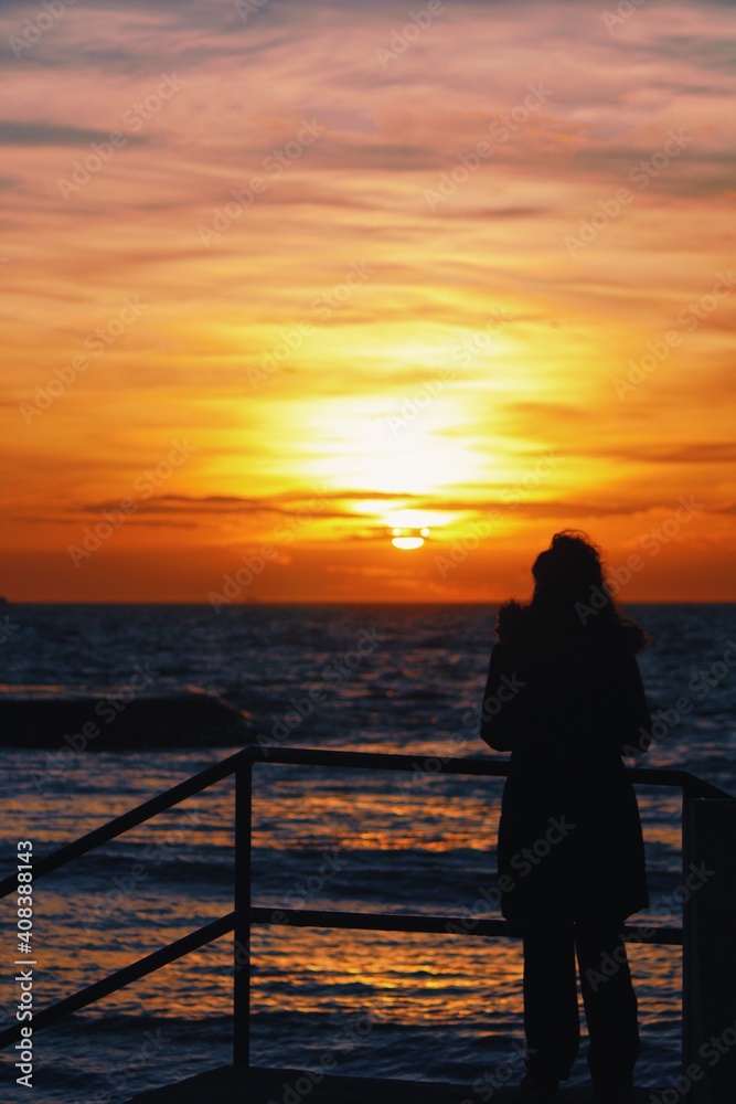 silhouette of a person on a pier silhouette of a person on a pier