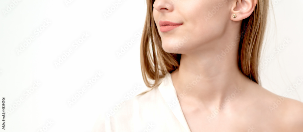 Half face portrait of a beautiful young caucasian woman on a white background with copy space Half face portrait of a beautiful young caucasian woman on a white background with copy space