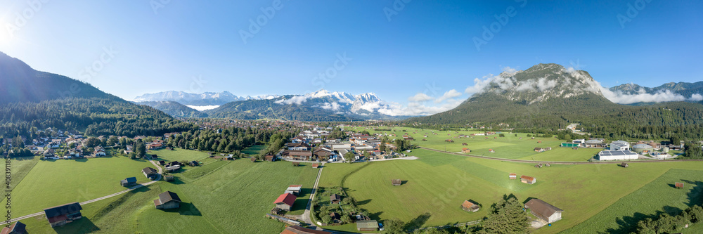 Aerial panorama view of Garmisch Partenkirchen Village with view of Zugspitze in fog