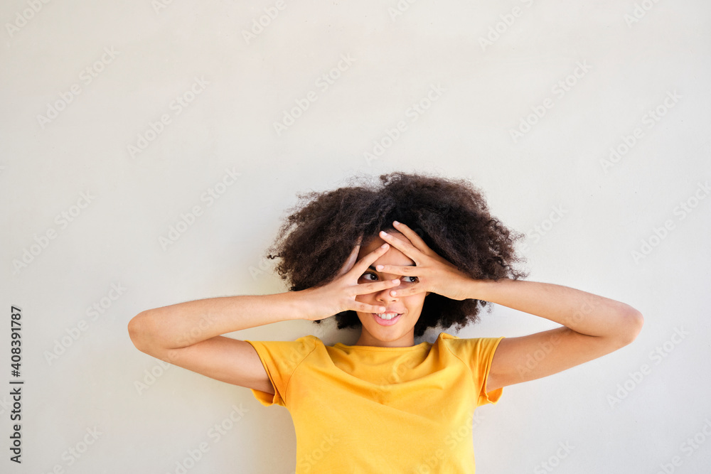 Frustrated student with head in hands standing against white wall Frustrated student with head in hands standing against white wall