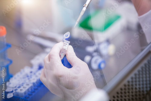 Scientist researching vaccine of novel coronavirus in laboratory photo