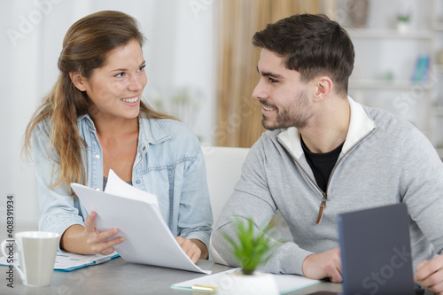 relaxed couple looking at paperwork