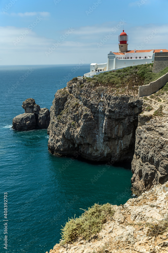 Rocky Coastline And Lighthouse At Cabo De Sao Vicente, Algarve, Portugal, Europe
