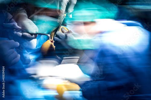 Male surgeons performing achilles tendon in operating room at hospital photo