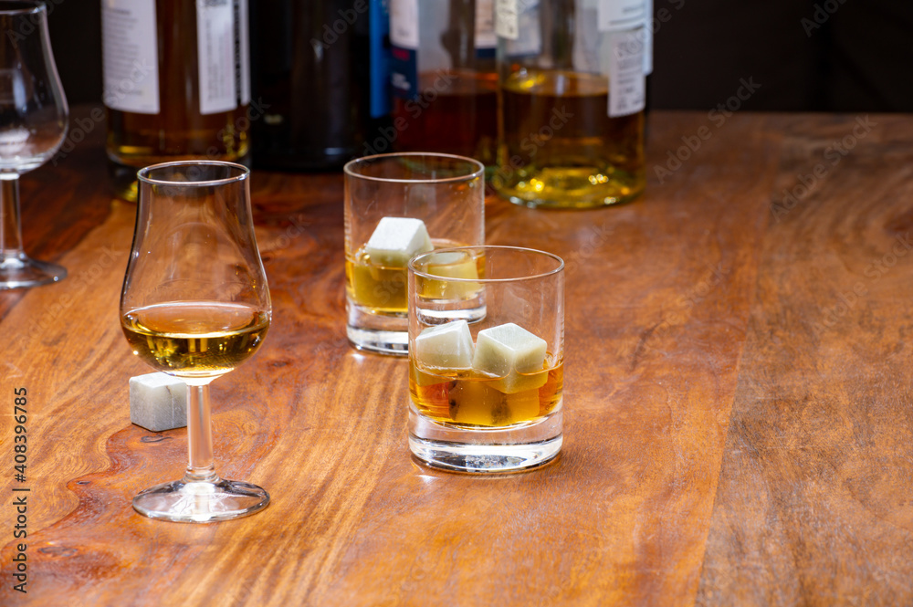 Tasting glass with strong alcoholic spirit drink whisky, cognac, armagnac or calvados