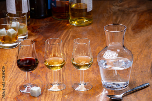 Tasting glass with strong alcoholic spirit drink whisky, cognac, armagnac or calvados