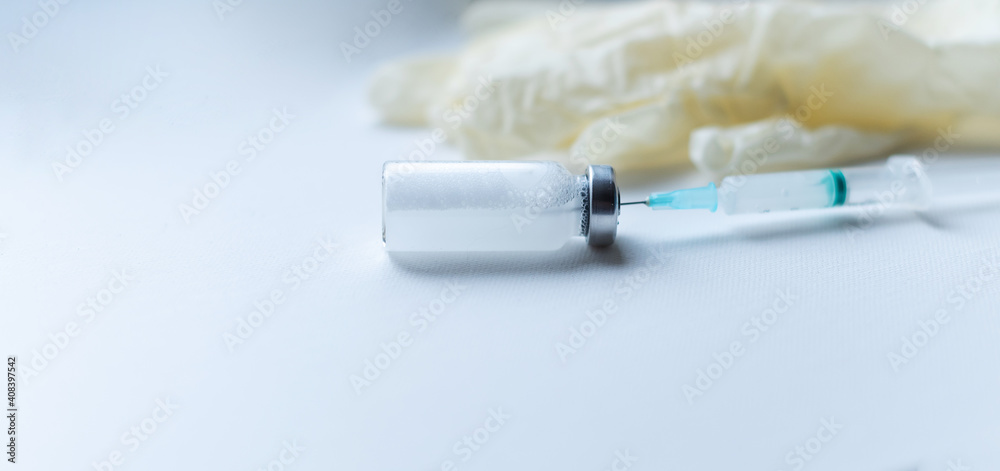 Vaccine vial and syringe injection for prevention and treatment from corona virus infection -corona virus. banner Vaccine vial and syringe injection for prevention and treatment from corona virus infection -corona virus. banner