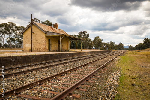 Rural train platform with old railway house