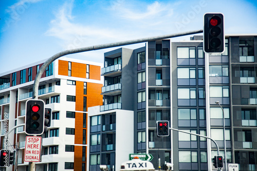 Red traffic light at intersection in city