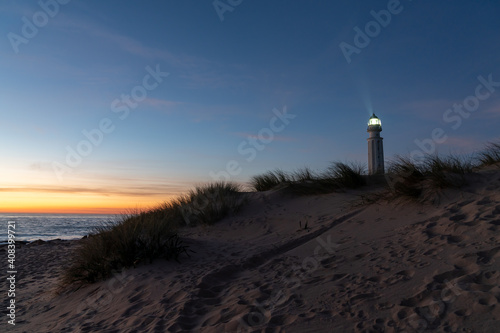 the Cape Trafalgar lighthouse signal light after sunset with colorful evening sky