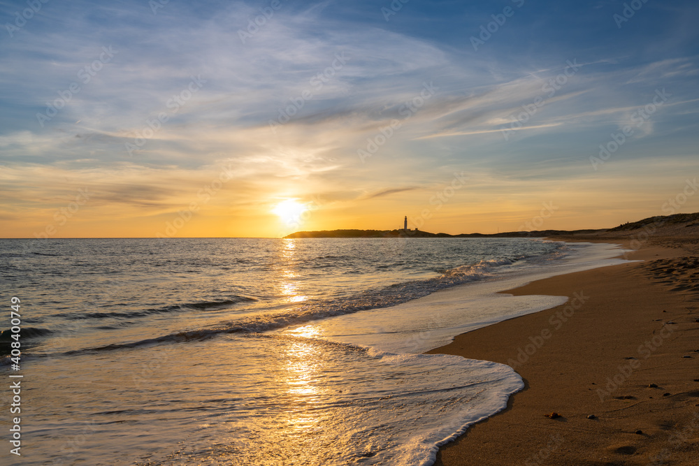 sunset on the Playa de Maria Sucia Beach with the Cape Trafalgar Lighthouse in the background