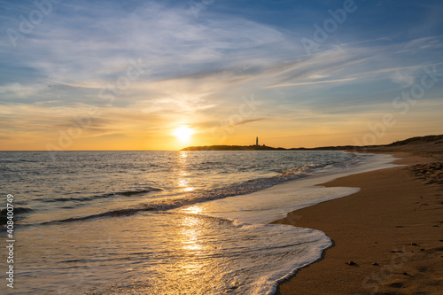 sunset on the Playa de Maria Sucia Beach with the Cape Trafalgar Lighthouse in the background