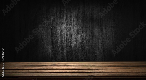 Selected focus empty brown wooden table and wall texture or old black brick wall blur background image. For your installation or product demonstration