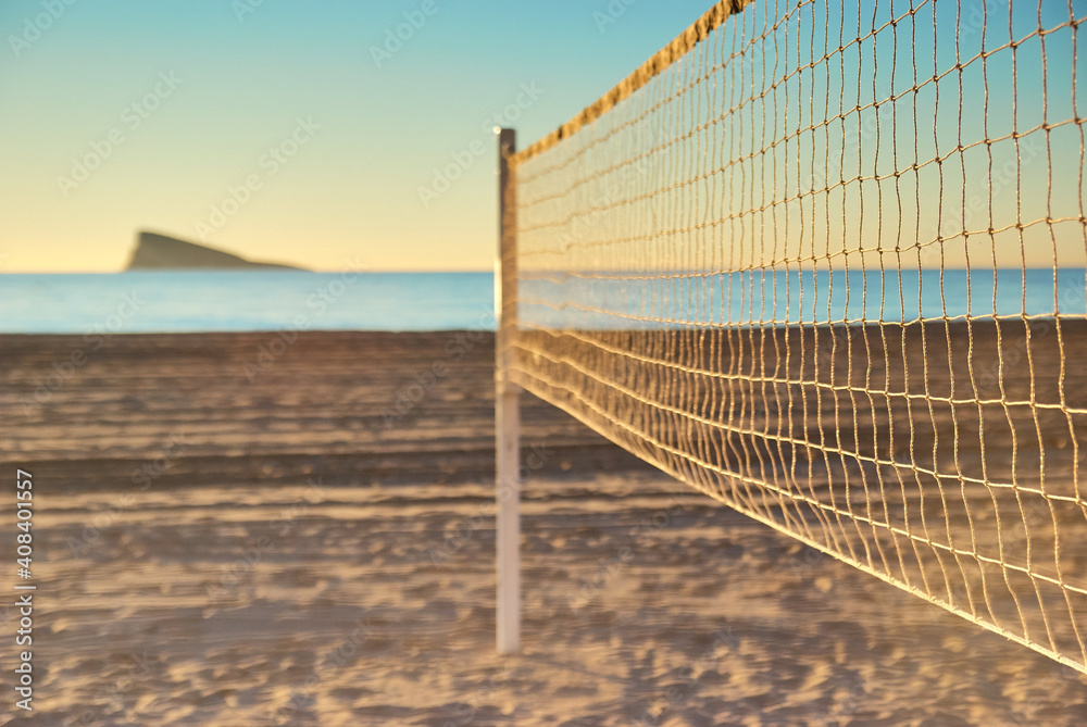 Beach volleyball court and net on Playa de Levante Beach in Benidorm, Spain Beach volleyball court and net on Playa de Levante Beach in Benidorm, Spain