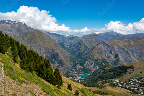 Hiking near ski station Les deux Alpes and view on Alpine mountains peaks in summer, Isere, France © barmalini