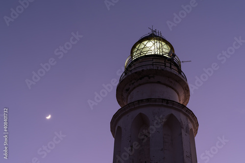 close up view of the Cape Trafalgar Lighthouse and a new moon
