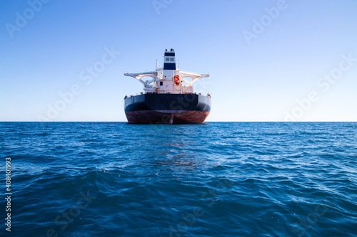 Rear view of freight ship offshore