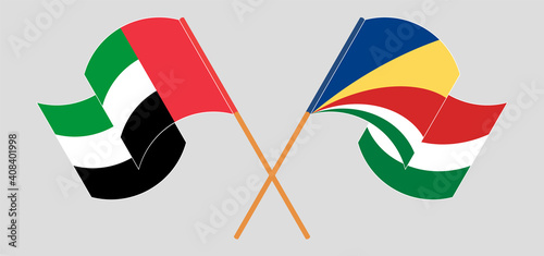 Crossed and waving flags of the United Arab Emirates and Seychelles