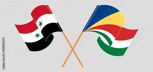 Crossed and waving flags of Syria and Seychelles