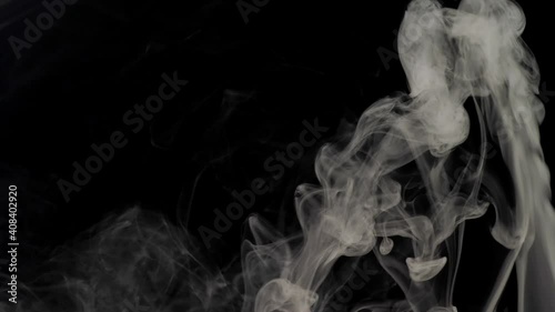 White smoke on a black background. Slow-motion. Vape smoke. Vapor, fog, ice smoke cloud, realistic smoke cloud best for using in 4k composition. Overlay (footage Background) for different projects