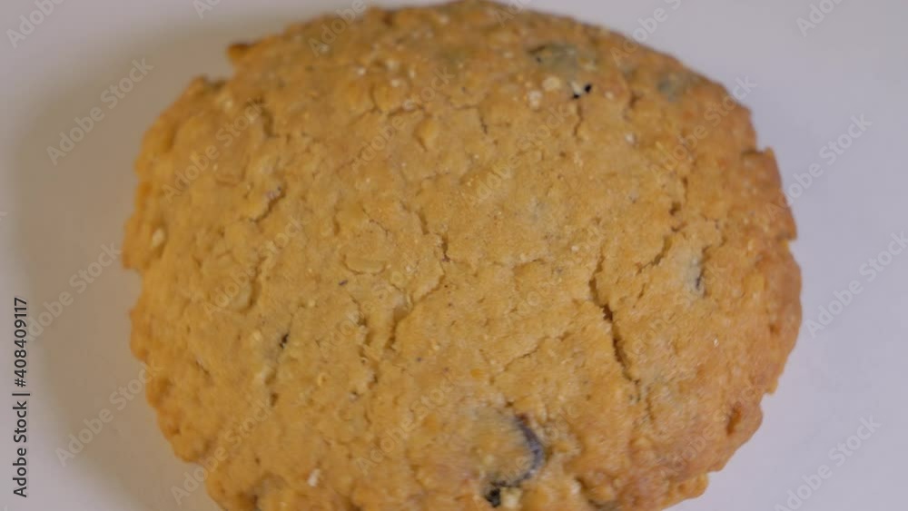 Oatmeal Chocolate Chip Cookies spins on a white background. Top down close up Oatmeal Chocolate Chip Cookies spins on a white background. Top down close up
