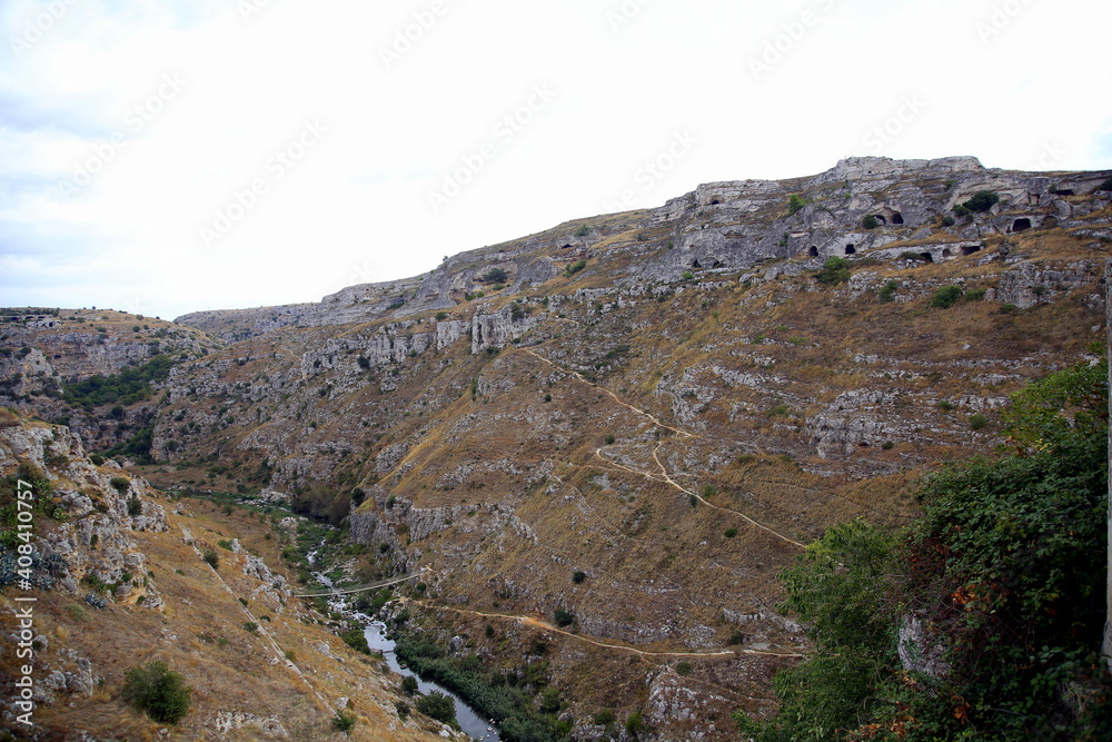 Tibetan bridge over the stream, between the walls of the ravine, Matera, European Capital of Culture 2019