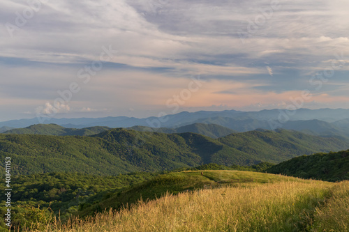 Trail at sunset, view from Max Patch bald over the Great Smoky Mountains