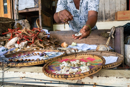 Local African Swahili People Selling Shells from the Ocean on the City Market, Fish Market in Dar Es Salaam, Tanzania photo
