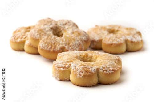 Several cookies covered with powdered sugar isolated on white background