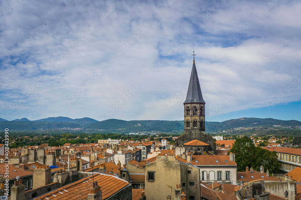 View from the top of the belfry on the Saint Amable basilica bell tower  and the roofs of the small town of Riom in Auvergne (France) 