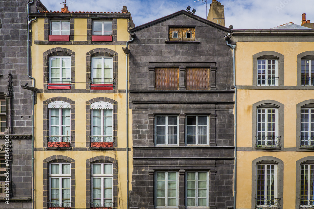 Obraz premium typical facades built with volcanic stones in the clock tower street (Rue de l'horloge), in Riom, a small town in Auvergne (France)