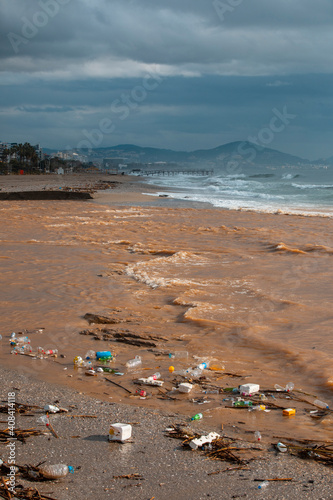 Waves pushing plastic waste to the beach