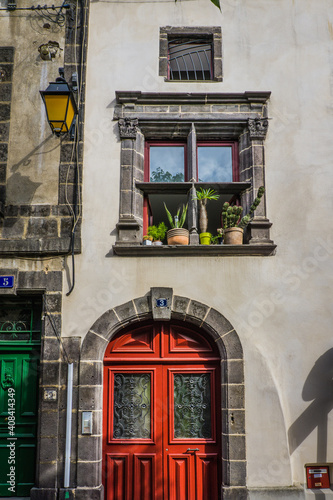 Cute facade of a medieval house built with volcanic stone in the  small city of Riom (Auvergne, France). photo