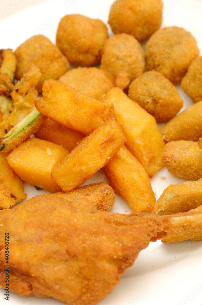 Mixed fried all'ascolana fritto all'ascolana includes olives all'ascolana, artichokes, courgettes, lamb cutlets and fried cream. Mixed fried all'ascolana fritto all'ascolana includes olives all'ascolana, artichokes, courgettes, lamb cutlets and fried cream.