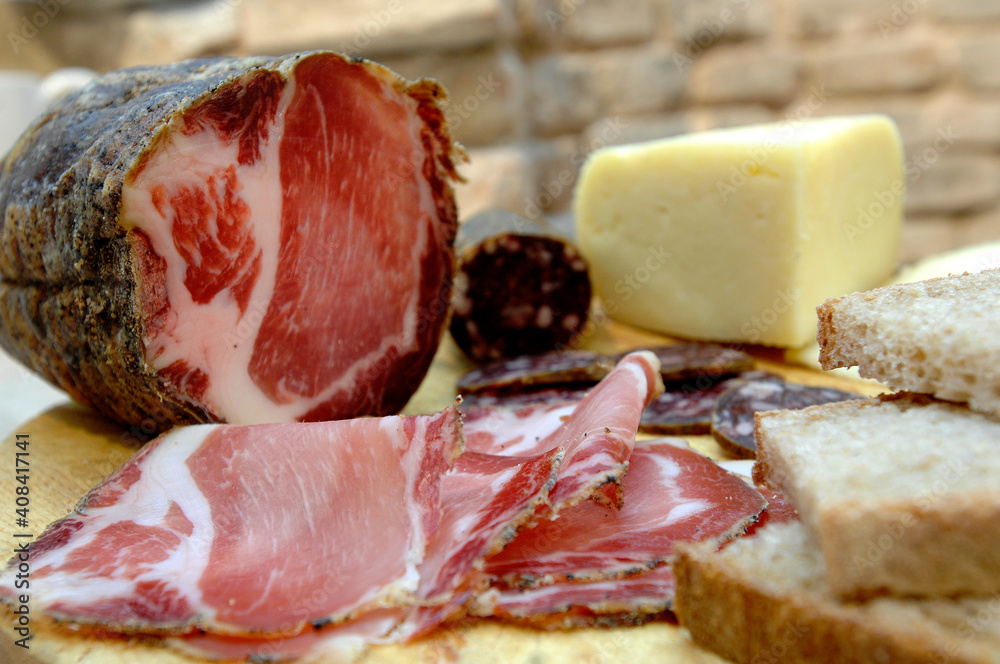 Pork loin typical salami of the Marche region in Italy and pecorino cheese from Sibillini mountains