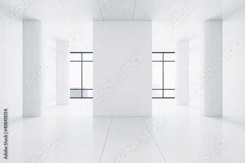 Minimalistic gallery interior with blank wall and columns.