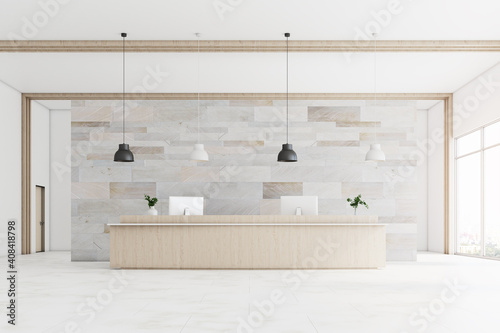 Office hall with wooden reception desk photo