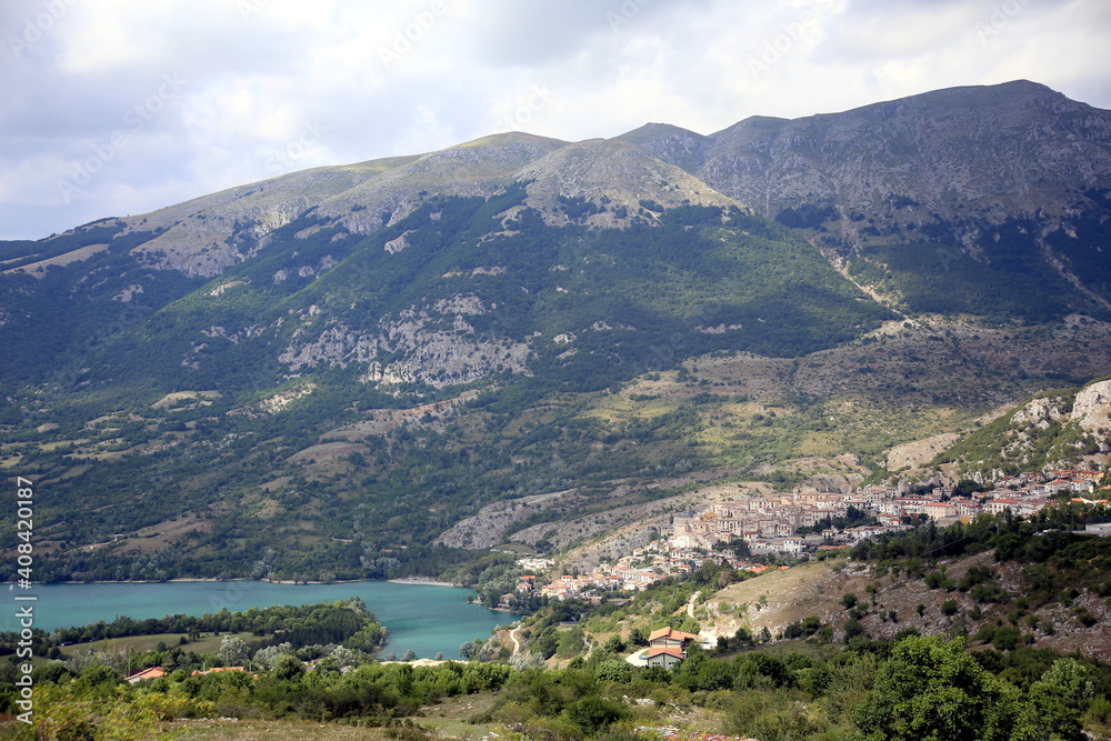 View from above of the small village in the mountains on the lake, Barrea, Abruzzo National Park, Italy