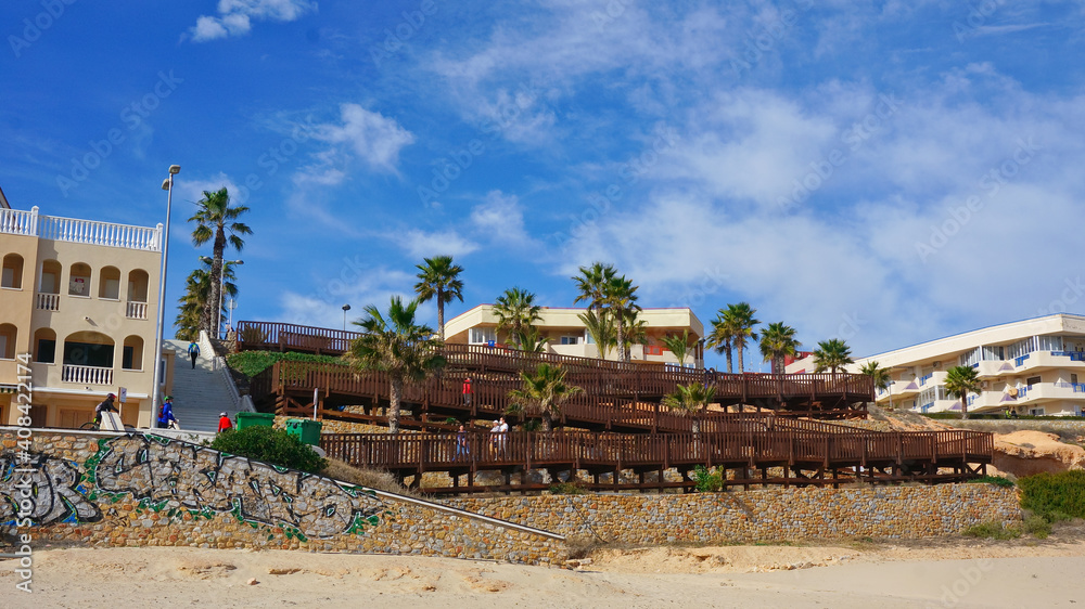 Fototapeta premium Alicante, Spain - January, 2021: Mil Palmeras beach, Pilar de la Horadada town, Mediterranean architecture . High quality photo