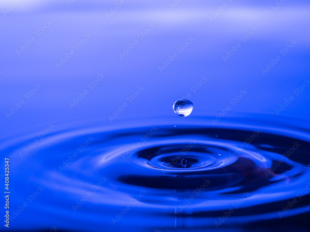 Splashing a drop of water into the aquarium. Colorful. Splashing a drop of water into the aquarium. Colorful.