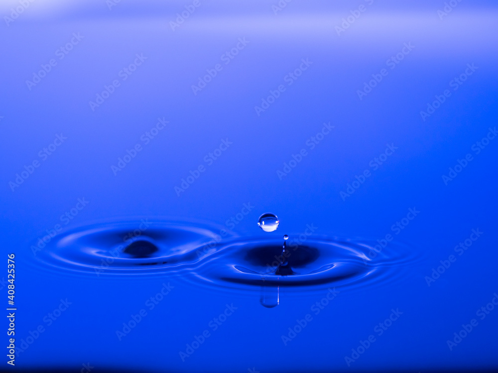 Splashing a drop of water into the aquarium. Colorful. Splashing a drop of water into the aquarium. Colorful.