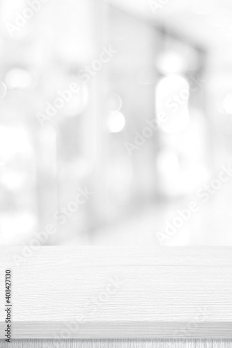 Vertical white table presentation, desk and blur background, Empty wood counter, shelf surface over blur restaurant white bokeh background, Wood table top for retail shop, store product display banner