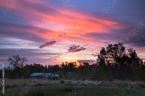 Beautiful sunset over Teds Hut and dam .Sedgefield near Singleton. Hunter Valley of  N.S.W. Australia.