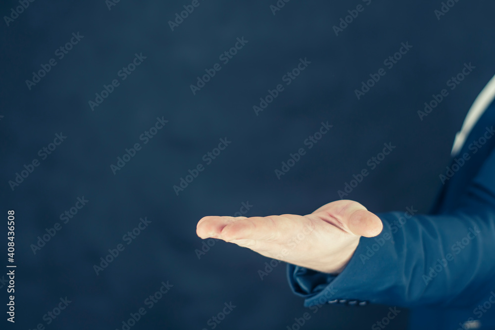 Businessman in a shirt and a blue jacket shows gestures with his hands. Businessman in a shirt and a blue jacket shows gestures with his hands.