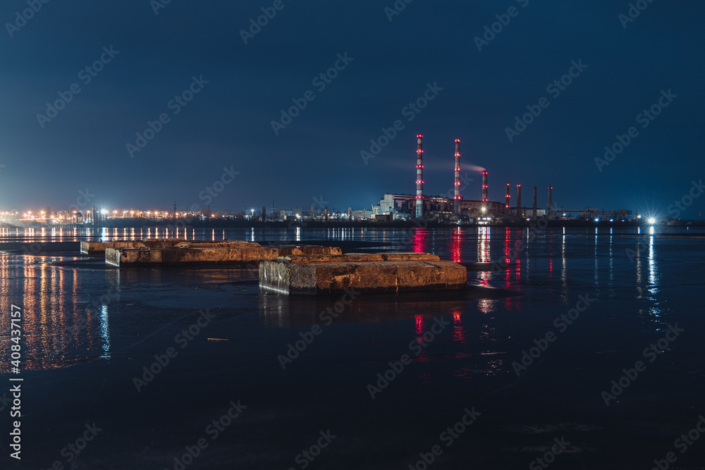 Beautiful city at night. Night city reflected in the water.